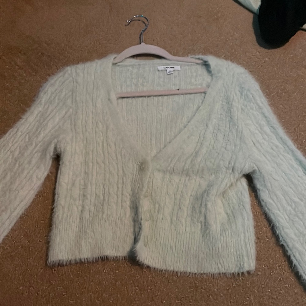 Green garage sweater